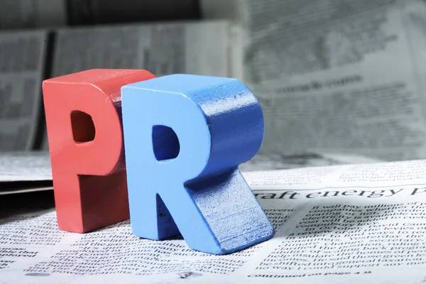 Word PR on newspaper — Stock Photo, Image