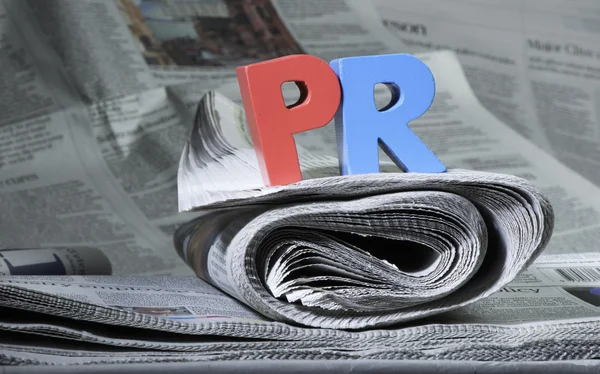 Word PR on newspaper — Stock Photo, Image