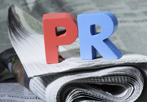 Word PR on newspaper — Stock Photo, Image