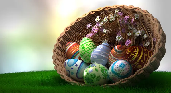 Oeufs de Pâques décorés sur l'herbe dans le panier — Photo