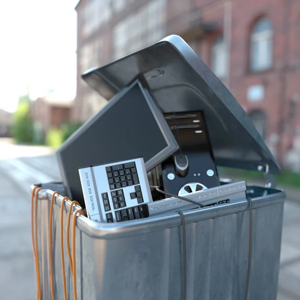 Computers in a trash bin on street — Stock Photo, Image