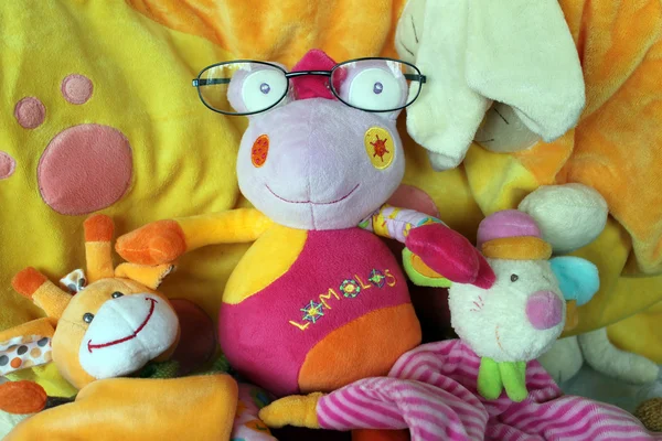 Bright children's plush toy in glasses Royalty Free Stock Images