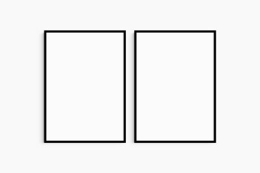 Çerçeve modeli 5x7, 50x70, A4, A3, A2, A1. İki tane ince siyah çerçeve. Galeri duvarı maketi, 2 kare set. Temiz, modern, minimalist, parlak. Portre. Dikey.