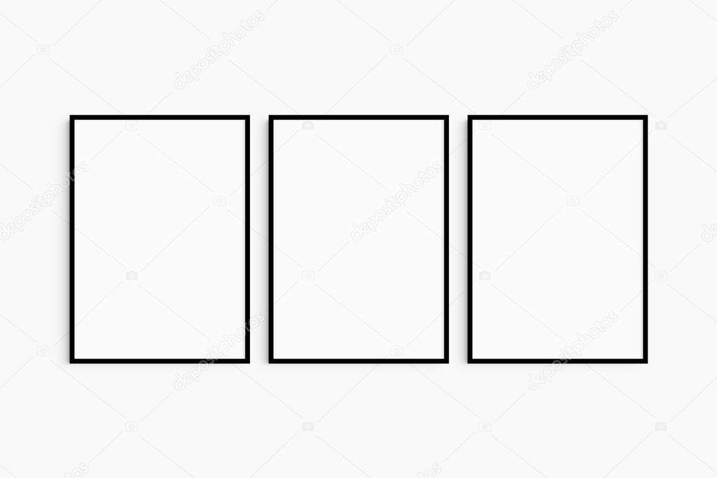 Frame mockup 5x7, 50x70, A4, A3, A2, A1. Set of three thin black frames. Gallery wall mockup, set of 3 frames. Clean, modern, minimalist, bright. Portrait. Vertical.