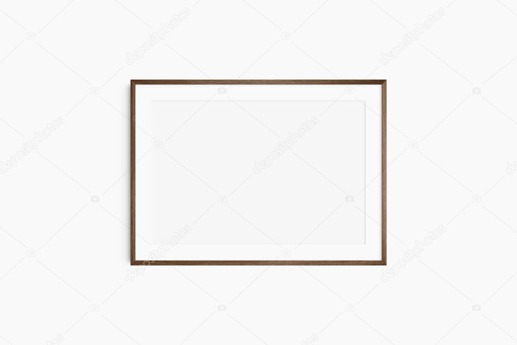 Horizontal frame mockup 7:5, 70x50, A4, A3, A2, A1 landscape. Single dark brown walnut wood frame mockup. Clean, modern, minimalist, bright. Passepartout/mat opening in 3:2 aspect ratio.