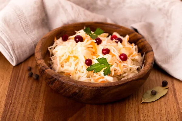 Wooden bowl of sauerkraut — Stock Image Wooden bowl of sauerkraut Royalty Free Stock Images