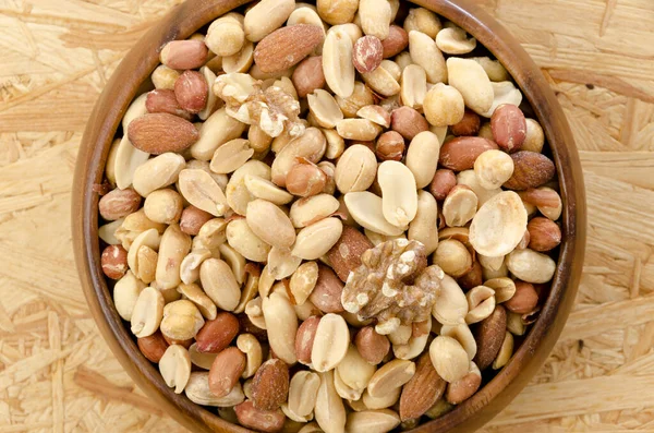 Mixed Nuts Wooden Bowl Plywood Board Background — Stock Photo, Image