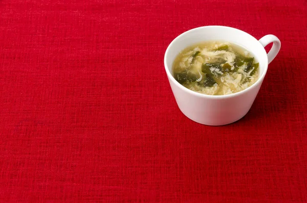 Wakame Seaweed Egg Drop Soup Cup Red Cloth Background — Stock Photo, Image