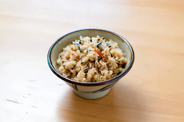 Kufajuicy (Okinawan-style cooked rice),Okinawa cuisine,japanese food,Rice mixed with Hijiki Seaweed, Carrots and pork broth.