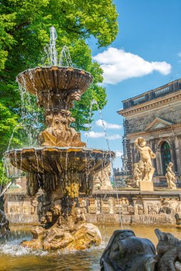 Cover page over Zwinger palace, gardens, statues and fountains with tourists at historical and museums downtown of Dresden, Germany