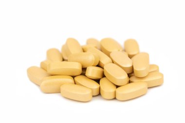 Altın haplar. Vitamin ilaçları.