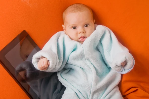 Funny baby with tablet — Stock Photo, Image