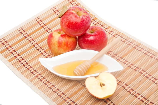 Sliced apple and honey dipper — Stock Photo, Image