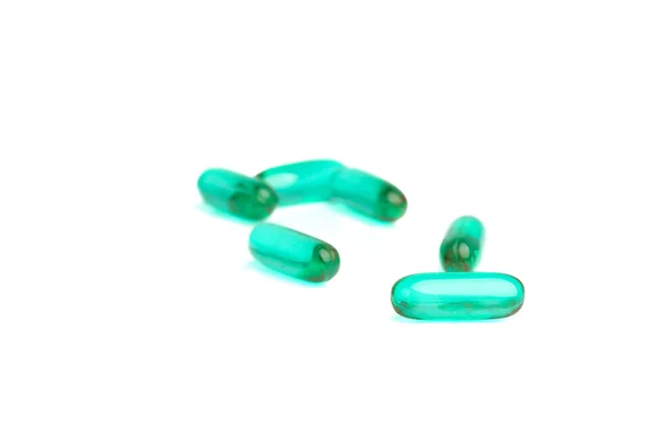 Grüne Pillen auf weiß — Stockfoto