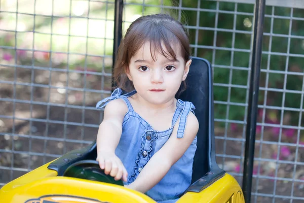 Little girl plays a driver — Stock Photo, Image