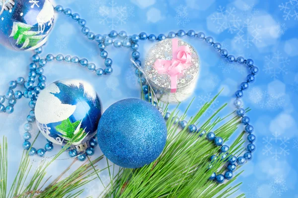 Three blue balls and a gift — Stock Photo, Image