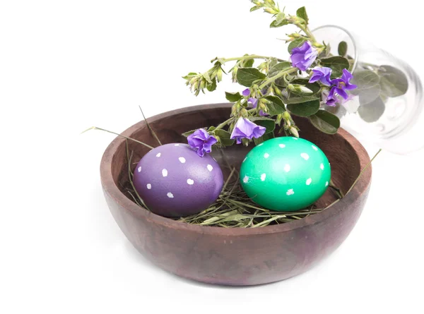 Polka dot eggs with field flowers — Stock Photo, Image