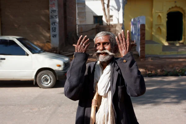 Emotional senior man take his hands up — Stock Photo, Image