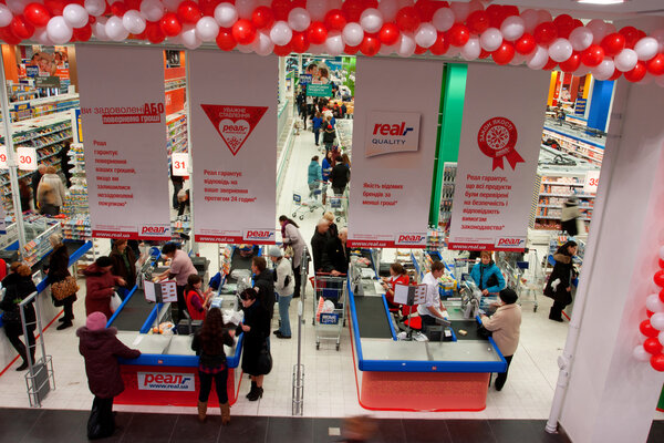 Customers pay at the cash register at the opening of the largest mall in Ukraine