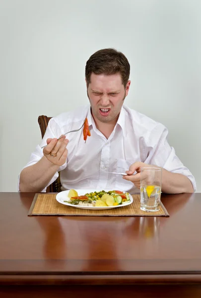 Man is disappointed with his dish — Stock Photo, Image