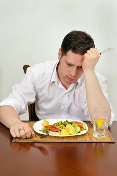 Людина відчуває розчарування з його блюдо — стокове фото