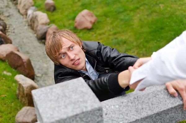 Young man falling down from the bridge — Stock Photo, Image