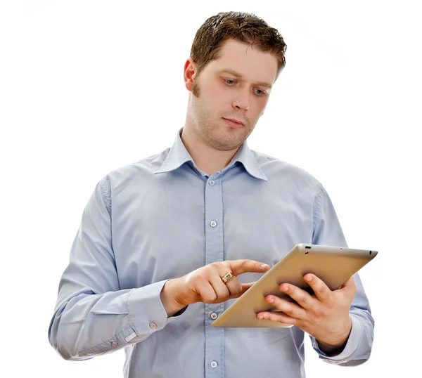 Bonito homem sério com computador tablet. Isolado em branco — Fotografia de Stock