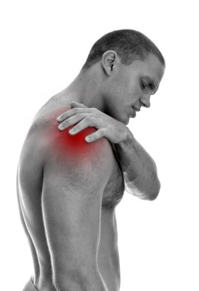 Young man suffering from pain in his shoulder. Isolated on white. black and — Stock Photo, Image