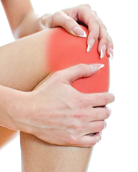 Close up view of male hands holding his sore knee. Isolated on white. — Stock Photo, Image