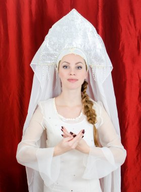Russian girl in traditional costume and kokoshnik clipart
