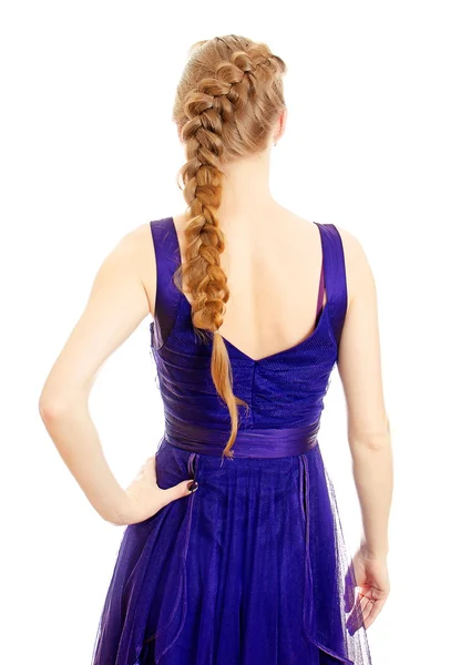 Woman with pigtail in blue dress from the back. Isolated on white. — Stock Photo, Image