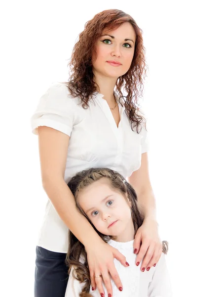 Woman giving a hug to her little daughter. Isolated on white — Stock Photo, Image