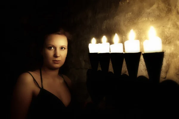 Portrait of young woman in dark mysterious castle — Zdjęcie stockowe