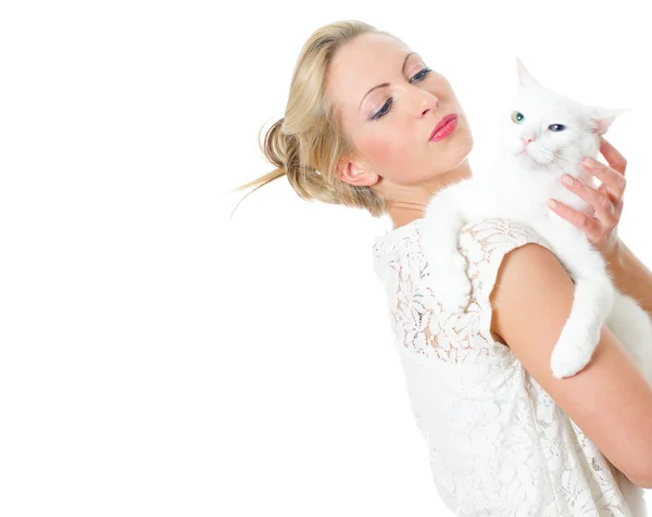 Young woman holding white cat. Isolated on white — Stock Photo, Image