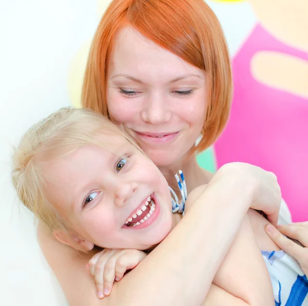 Happy mother with her smiling daughter — Stock Photo, Image