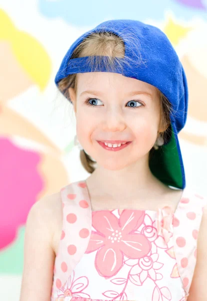 Cute little girl in a baseball cap — Stock Photo, Image