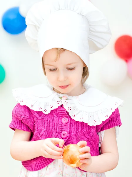 Little girl in chief hat cooking dinner — Stock Photo, Image