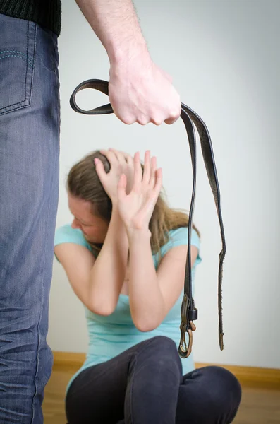 Man with belt coming to his wife. Home violence concept — Stock Photo, Image