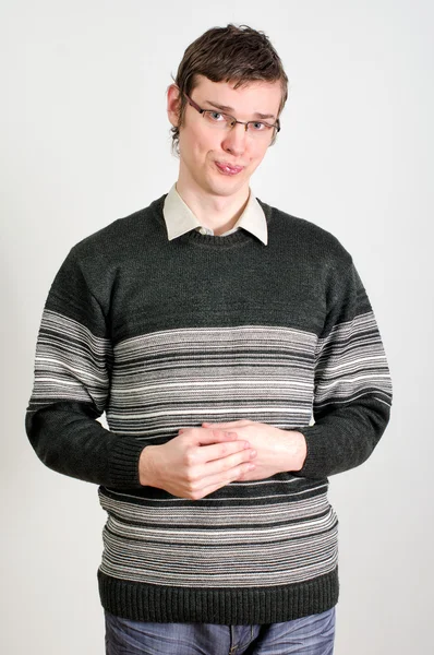 Portrait of young shy guy in glasses Royalty Free Stock Images