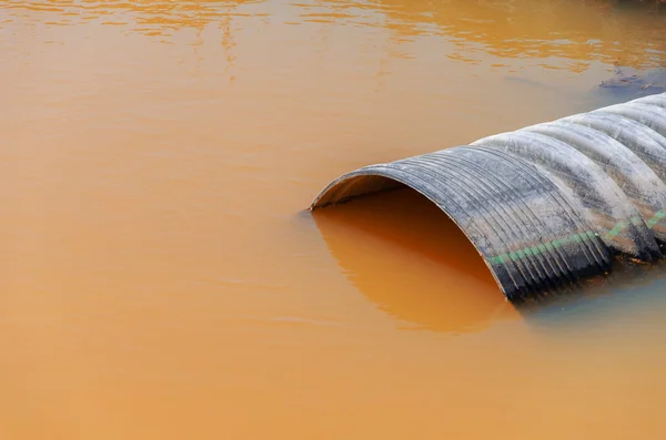 Dirty water stems from the pipe — Stock Photo, Image