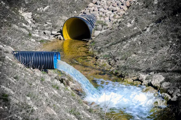 Waste water pipe polluting environment — Stock Photo, Image