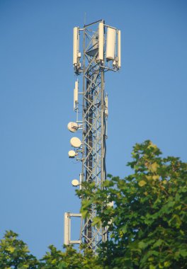 Cellular tower in forest clipart