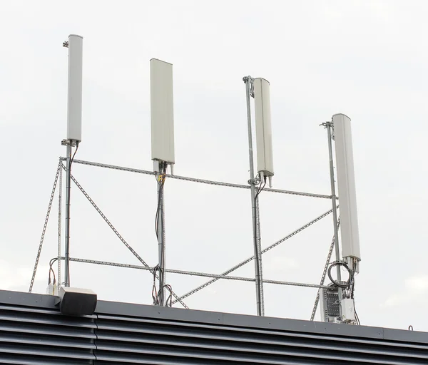 Four cellular towers on the roof — Stock Photo, Image