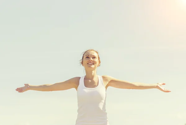 Young smiling female with arms wide open — Stock Photo, Image