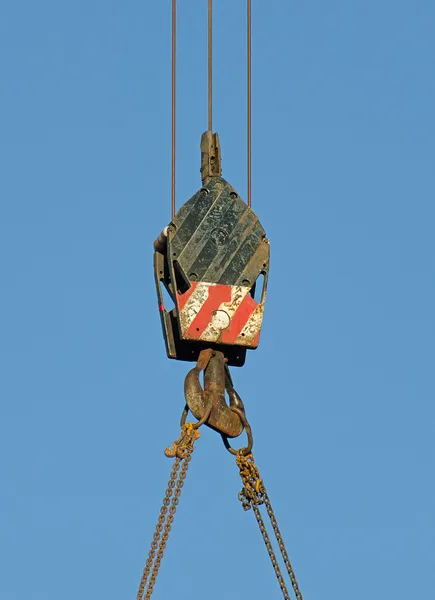 Crane hook over blue sky. — Stock Photo, Image