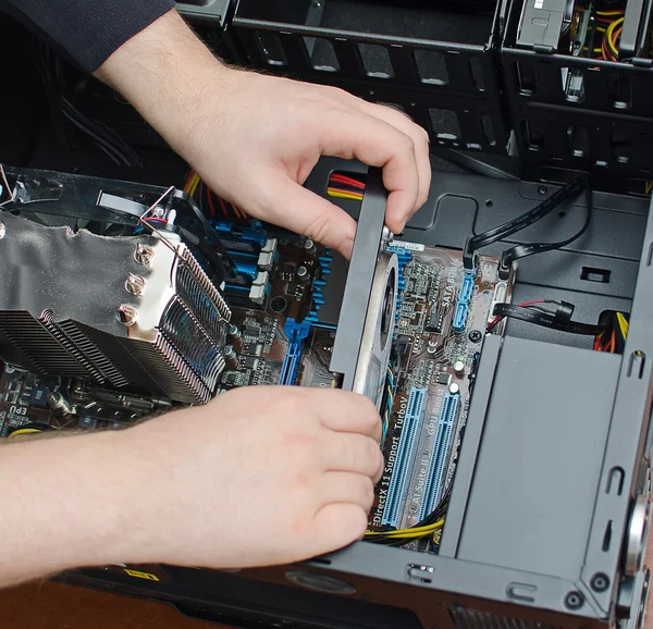 Hands of technician installing graphic card — Stock Photo, Image