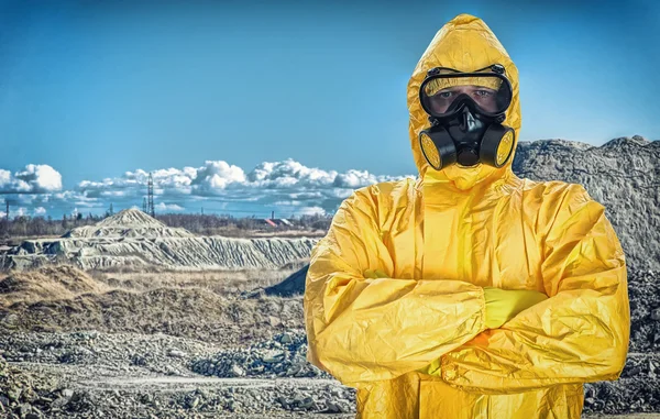 Worker in protective chemical suit over mountains. — Stock Photo, Image