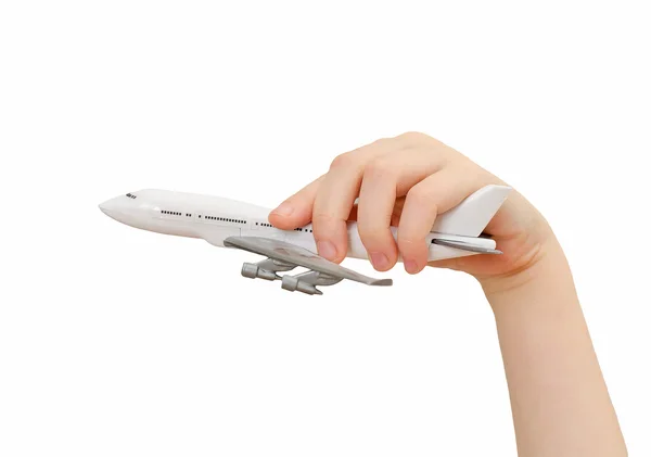 Child hand holding model airplane. Isolated on white. — Stock Photo, Image
