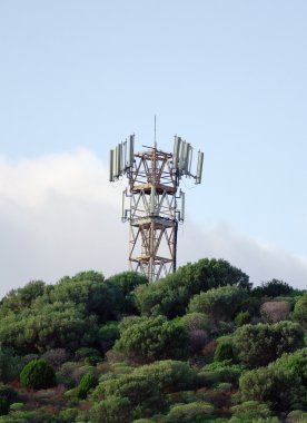 Cellular tower on the top of mountain. clipart