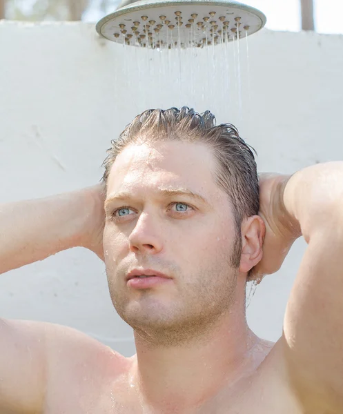 Attractive man having shower outdoors. — Stock Photo, Image